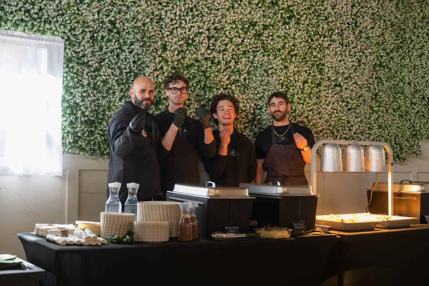 Matteo Zacchino and the Vespa catering team behind a wedding buffet in Sedona